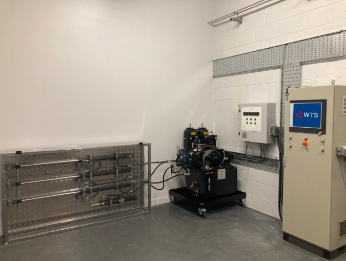 A room featuring a wind turbine simulator, showcasing unique equipment designed by WTS for training and demonstration purposes.