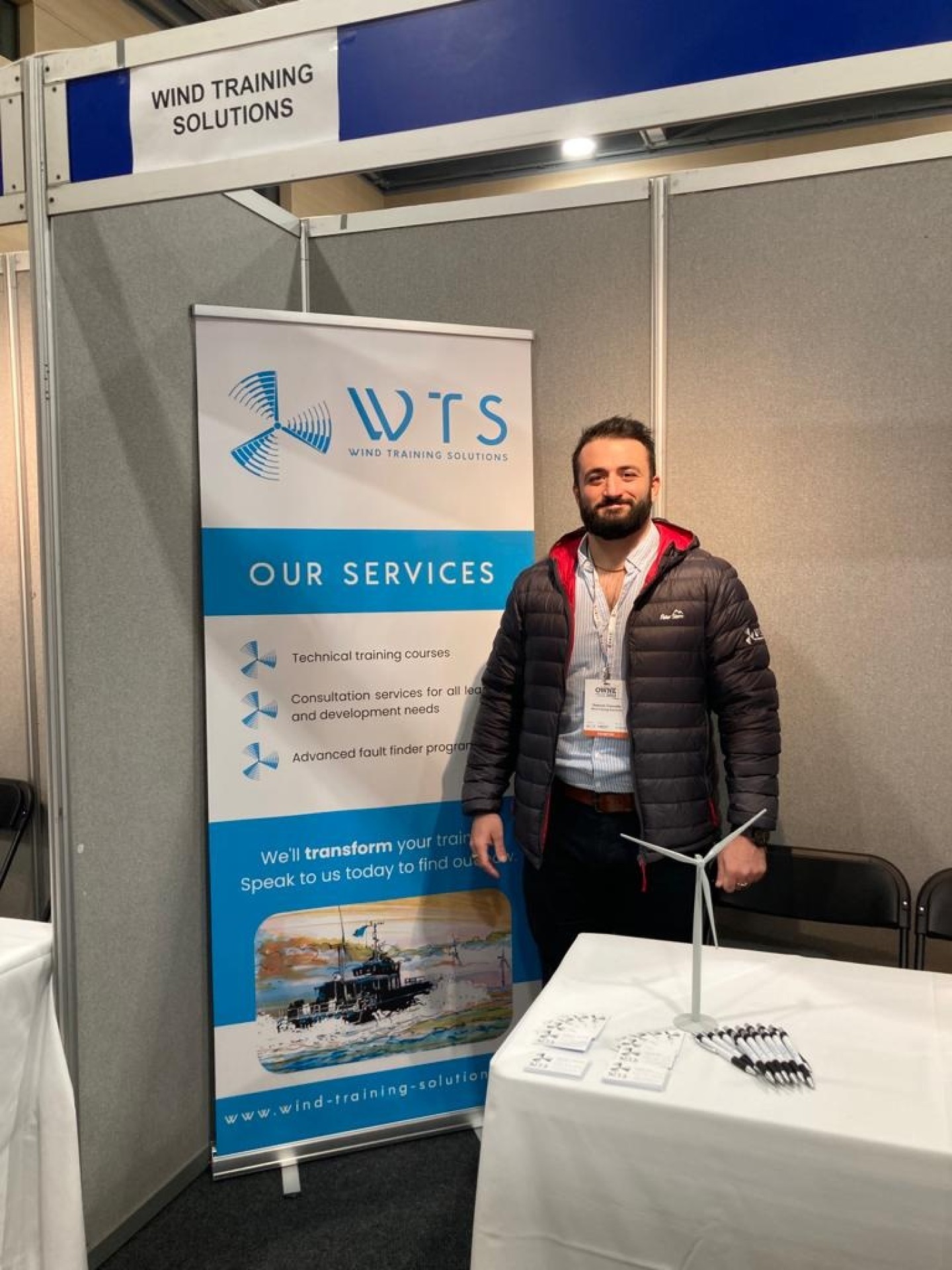 Dominic in front of the WTS exhibition stand at NOF OWNE 2022